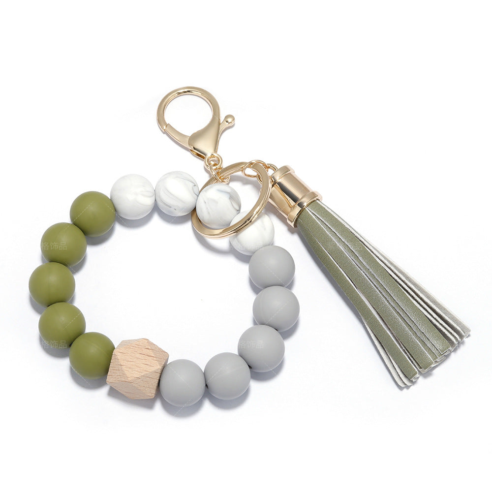 Venta al por mayor de silicona con cuentas de cuero PU borla pulsera pulsera